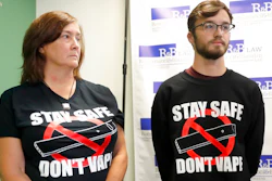 Adam Hergenreder, right, and his mother Polly, attend a news conference where their attorney announced the filing of a civil lawsuit against e-cigarette maker Juul on Hergenreder's behalf Friday, Sept. 13, 2019, in Chicago. The lawsuit filed Friday in Lake County, Illinois, Circuit Court alleges Juul Labs, Inc., deliberately targeted young people through Instagram and other sites to suggest vaping can boost their social status. It also says Juul doesn't fully disclose their products contain dangerous chemicals.