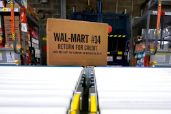 In this Nov. 9, 2018, file photo, a box of merchandise is unloaded from a truck and sent along a conveyor belt at a Walmart Supercenter in Houston. Walmart is rolling out an unlimited grocery delivery subscription service this fall for a $98 annual fee. The service will reach 1,400 stores in 200 markets and allows the nation’s largest grocer to further tap into time-starved shoppers looking for convenience.