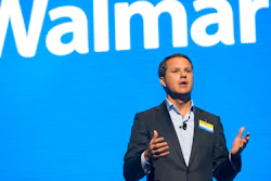 In this June 2, 2017 file photo, Walmart CEO Doug McMillon speaks during the Walmart shareholders meeting at Bud Walton Arena in Fayetteville, Ark. The Business Roundtable, a group that represents the most powerful companies in America, is naming McMillon as its new chairman. McMillon succeeds JPMorgan Chase Chairman and CEO Jamie Dimon in the role. Dimon will continue to serve as a board member after completing his tenure as the group's chairman at year's end.