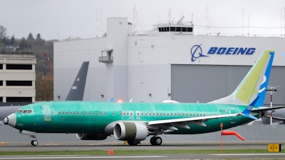In this April 10, 2019, file photo a Boeing 737 MAX 8 airplane being built for Spain-based Air Europa rolls toward takeoff before a test flight at Boeing Field in Seattle. The head of the Federal Aviation Administration is defending his agency's approval of a troubled Boeing plane while leaving open the possibility of changing how the agency certifies aircraft. Stephen Dickson made the comments Monday, Sept. 23, in Montreal, where he and other top FAA officials briefed aviation regulators from around the world on the agency's review of changes that Boeing is making to the 737 Max. The FAA said a senior Boeing official also gave a technical briefing.