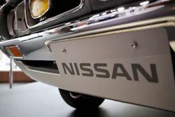 In this May 11, 2017 file photo, a Nissan car is displayed at its showroom in Tokyo. Nissan is recalling 1.3 million vehicles in the U.S., Canada and other countries to fix a problem with backup camera displays. The recall covers most of the Nissan and Infiniti model lineups from the 2018 and 2019 model years.