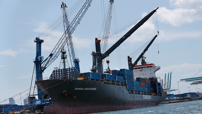In this July 24, 2019 file photo, the container ship Hansa Augsburg is shown docked at PortMiami in Miami.