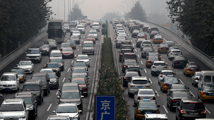 In this Oct. 26, 2017 file photo, motorists are clogged with heavy traffic on a city ring road in Beijing.