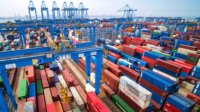 In this May 14, 2019 file photo, containers are piled up at a port in Qingdao in east China's Shandong province.