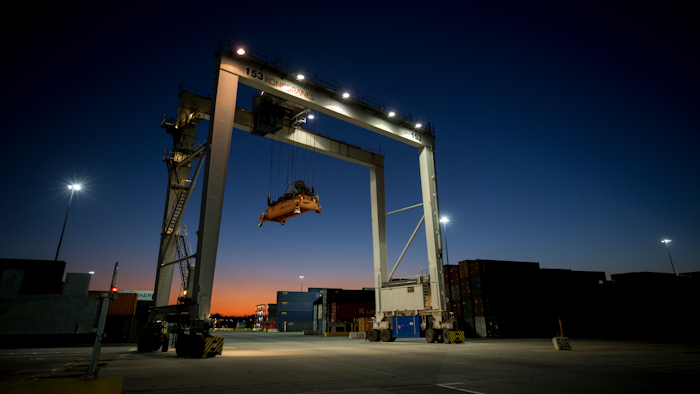 In this Jan. 30, 2018 file photo, a rubber tire gantry moves into position to transfer shipping containers at the Georgia Ports Authority's Port of Savannah in Savannah, GA.