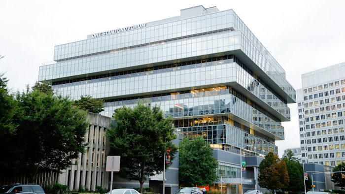 In this Sept. 12, 2019, file photo, cars pass Purdue Pharma headquarters in Stamford, Conn. OxyContin maker Purdue Pharma paid its CEO $9 million and its board chairman nearly $4 million in the 12 months before the company's bankruptcy filing last month, according to financial documents filed with the bankruptcy court this week.