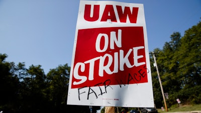 Workers picket outside a General Motors facility in Langhorne, PA on Sept. 23.