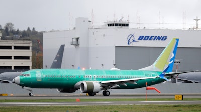 In this April 10, 2019 file photo, a Boeing 737 MAX 8 airplane being built for Spain-based Air Europa rolls toward takeoff before a test flight at Boeing Field in Seattle.