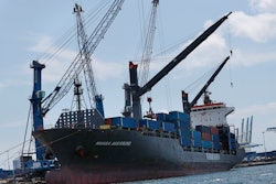 In this July 24, 2019 file photo, the container ship Hansa Augsburg is shown docked at PortMiami in Miami.