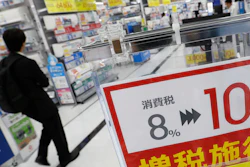 In this Sept. 30, 2019, photo, a signboard reads 'Consumption tax hike, 8 percent to 10 percent', at a mass home electronics retailer in Tokyo.