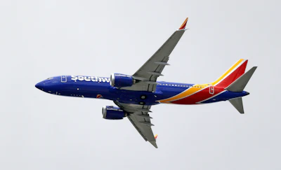 In this March 13, 2019 file photo, a Southwest Airlines Boeing 737 Max 8 jet flies over Mesa, Ariz., en route to Phoenix's Sky Harbor International Airport.