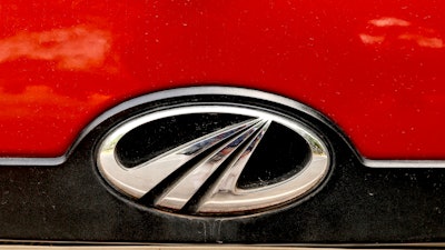 Mahindra and Mahindra logo is seen at the back of its vehicle in New Delhi, India on Tuesday, Oct. 1.
