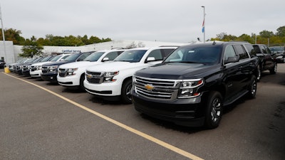 In this Sept. 30, 2019 photo, a row of Chevrolet Suburban vehicles are shown at Wally Edgar Chevrolet in Orion Township, MI