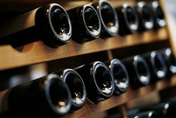 Wine bottle are seen in a wine shop in Paris on Thursday, Oct. 3.