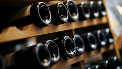 Wine bottle are seen in a wine shop in Paris on Thursday, Oct. 3.