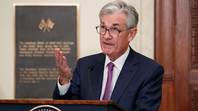 Federal Reserve Chairman Jerome Powell speaks before attending a panel at the Federal Reserve Board Building Friday in Washington.