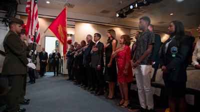 First lady Melania Trump, center, and acting DEA Administrator Uttam Dhillon, center left, stands at a Red Ribbon Rally at the Drug Enforcement Agency in Arlington, VA, on Monday, Oct. 7. Also pictured is Mika Camarena, third from right, the wife of former DEA agent Kiki Camarena who was killed in 1985 while on assignment in Mexico.