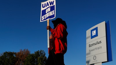 Yolanda Jacobs, a United Auto Workers member, walks the picket line at the General Motors Romulus Powertrain plant in Romulus, MI on Wednesday.