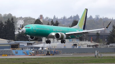 In this April 10, 2019 photo, a Boeing 737 MAX 8 airplane being built for India-based Jet Airways lands following a test flight at Boeing Field in Seattle.
