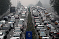 In this Oct. 26, 2017 file photo, motorists are clogged with heavy traffic on a city ring road in Beijing.