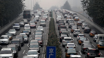 In this Oct. 26, 2017 file photo, motorists are clogged with heavy traffic on a city ring road in Beijing.