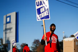 A member of the United Auto Workers walks the picket line at the General Motors Romulus Powertrain plant in Romulus, MI on Oct. 9.