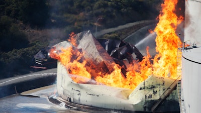 A tank burns as fire breaks out at a refinery in Crockett, CA, on Tuesday.