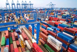 In this May 14, 2019 file photo, containers are piled up at a port in Qingdao in east China's Shandong province.
