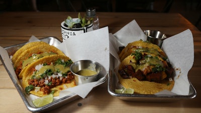 In this Oct. 18 photo is two of the taco selections at the Earth Plant Based Cuisine restaurant in Phoenix, AZ.