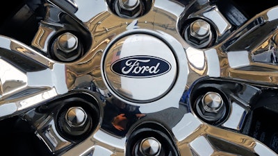 In this Feb. 14, 2019 file photo, a wheel on a 2019 Ford Expedition 4x4 is displayed at the 2019 Pittsburgh International Auto Show in Pittsburgh.