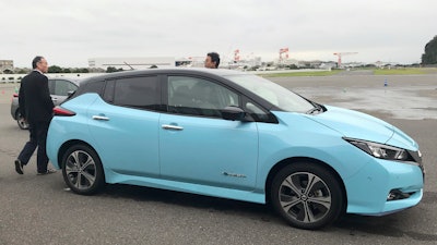 In this Oct. 18 photo, Nissan's electric vehicle with new 'all-wheel-control' technology is ready for a demonstration to reporters at its Oppama test driving course in Yokosuka, near Tokyo.