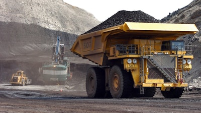 In this April 4, 2013 file photo, a truck carrying 250 tons of coal hauls the fuel to the surface of the Spring Creek mine near Decker, MT.