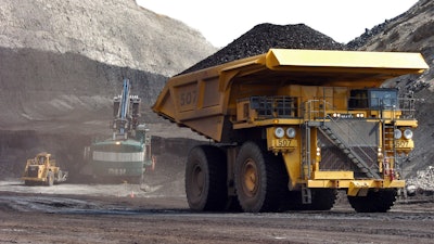 In this April 4, 2013 file photo, a truck carrying 250 tons of coal hauls the fuel to the surface of the Spring Creek mine near Decker, MT.