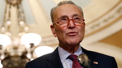 In this Oct. 22 photo, Senate Minority Leader Sen. Chuck Schumer of N.Y., speaks to members of the media following a Senate policy luncheon on Capitol Hill in Washington.