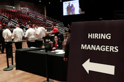 In this Tuesday, June 4, 2019 file photo, managers wait for job applicants at the Seminole Hard Rock Hotel & Casino Hollywood during a job fair in Hollywood, FL.