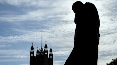 The statue of former Prime Minister Sir Winston Churchill stands in London's Parliament Square on Monday, Oct. 28.