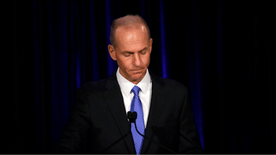 In this April 29, 2019, file pool photo, Boeing Chief Executive Dennis Muilenburg speaks at a news conference after company's annual shareholders meeting at the Field Museum in Chicago.