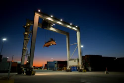 In this Jan. 30, 2018 file photo, a rubber tire gantry moves into position to transfer shipping containers at the Georgia Ports Authority's Port of Savannah in Savannah, GA.