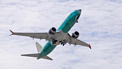 In this May 8, 2019, file photo a Boeing 737 MAX 8 jetliner being built for Turkish Airlines takes off on a test flight in Renton, Wash. Passengers who refuse to fly on a Boeing Max won’t be entitled to compensation if they cancel. However, travel experts think airlines will be very flexible in rebooking passengers of giving them refunds if they’re afraid to fly on a plane that has crashed twice.