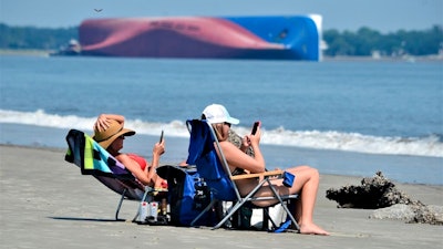 Marine salvage experts seeking to remove the overturned cargo ship close to Georgia's seacoast will haul it away in pieces because it cannot be safely righted and refloated intact, their Unified Command said in a statement Saturday, Oct. 12.