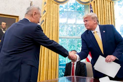 In this Oct. 11, 2019, file photo, U.S. President Donald Trump, right, shakes hands with Chinese Vice Premier Liu He after being given a letter in the Oval Office of the White House in Washington. China's trade with the United States fell by double digits again in September amid a tariff war that threatens to tip the global economy into recession.