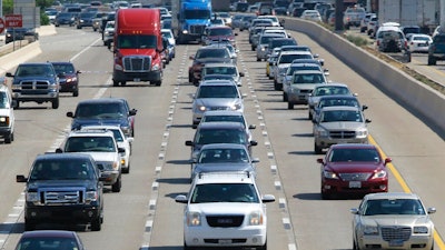 In this July 1, 2016 file photo, drivers work their way out of Dallas during rush hour. The U.S. government's road safety agency says traffic deaths fell by a small amount for the second straight year. The National Highway Traffic Safety Administration attributed the 2.4% drop partially to technology in newer vehicles that can prevent crashes. The agency says the downward trend is continuing into 2019. First-half estimates show fatalities down 3.4%.