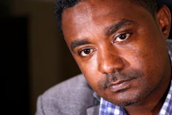 In this photo taken Monday, Sept. 23, 2019, Yonas Yeshanew, who resigned as Ethiopian Airline's chief engineer this summer and is seeking asylum in the U.S., listens to a reporter's question during an interview in Seattle area. Yeshanew says in a whistleblower complaint filed with regulators that the carrier went into the maintenance records on a Boeing 737 Max jet a day after it crashed this year, a breach he contends was part of a pattern of corruption that included fabricating documents, signing off on shoddy repairs and even beating those who got out of line.