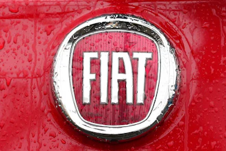 In this Jan. 2, 2014 file photo, a Fiat logo pictured on a car in Milan, Italy. Italian-American carmaker Fiat Chrysler Automobiles on Wednesday, Oct. 30, 2019 confirmed that it is in talks with French rival PSA Peugeot, its second bid this year to reshape the global auto industry facing huge challenges with the transition to electric and autonomous vehicles.