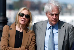 In this May 22, 2019 file photo, Marcia, left, and Gregory Abbott leave federal court after they pleaded guilty to charges in a nationwide college admissions bribery scandal. They are scheduled to be sentenced on Tuesday, Oct. 8.