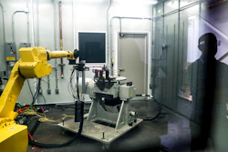 In this May 18, 2017, file photo, a robotic arm with a high-intensity blowtorch is remotely operated to test ceramic matrix composites, which make engines more durable, heat-resistant and efficient, at the General Electric Aviation plant in Evendale, Ohio. General Electric Co. said Monday, Oct. 7, 2019, that it will freeze its pension plan for about 20,700 salaried workers as part of its debt-cutting plan.