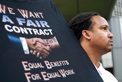 Sean Crawford, of United Auto Workers 598, rallies outside the Marriott Renaissance Hotel while the UAW GM Council holds a meeting inside the hotel in Detroit, Sunday Sept. 15, 2019. The new four-year deal between General Motors and 49,000 United Auto Workers will drive up the company’s expenses with pay raises, bonuses and other increases. But analysts say GM is far better able to handle the expenses now than it was a decade ago, when the high cost of labor helped send it into bankruptcy protection.