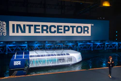 Young Dutch inventor Boyan Slat, right, unveils the Interceptor in Rotterdam, Netherlands, Saturday, Oct. 26, 2019. Slat is taking his effort to clean up floating plastic from the Pacific Ocean to rivers, using the Interceptor, a new floating device to catch garbage before it reaches the seas.