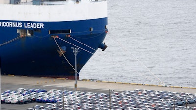 In this July 8, 2019, photo, cars for export are parked at Kawasaki port, near of Tokyo. Japan has logged a third straight month of a trade deficit in September, according to the latest government data, as trade tensions between China and the U.S. crimped exports. Japan’s Finance Ministry reported Monday, Oct. 21, the nation’s trade deficit in September totaled 122.98 billion yen ($1.13 billion).