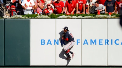 Atlanta Braves' Ronald Acuna Jr. (13) catches a ball hit by St. Louis Cardinals' Dexter Fowler during the fifth inning in Game 4 of a baseball National League Division Series, Monday, Oct. 7, 2019, in St. Louis.